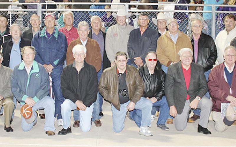 The Jacksboro football players from the 1962 State Championship Team reunited with their coach Chuck Curtis, back center, during the 2012 Homecoming.